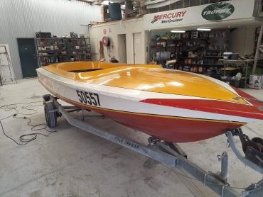 Speedboat on trailer in workshop