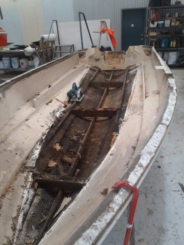 Boat restoration in workshop interior