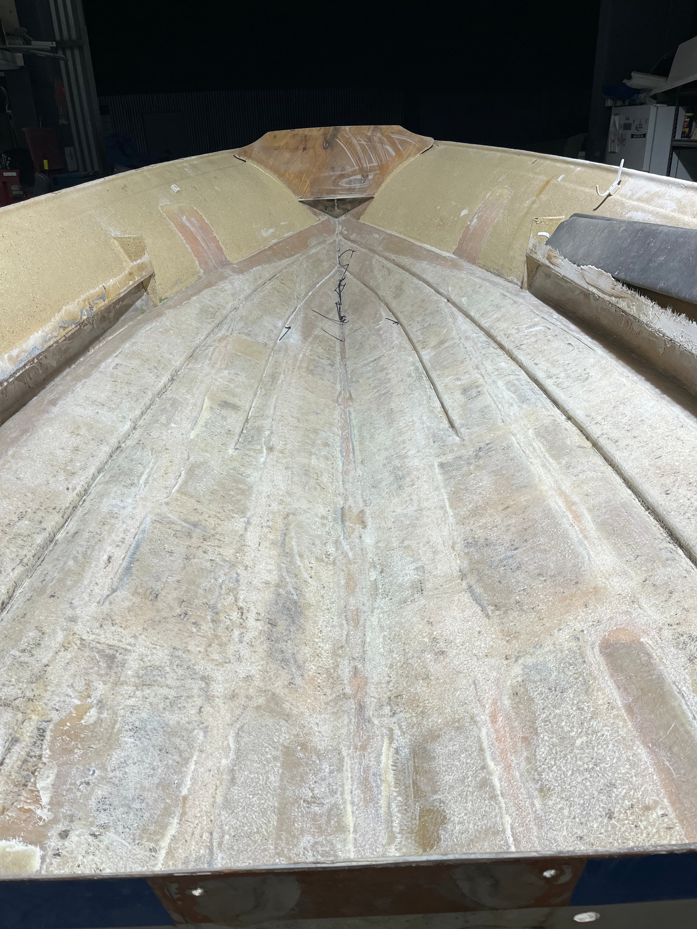 Bare fibreglass hull interior stripped back ready for rebuild