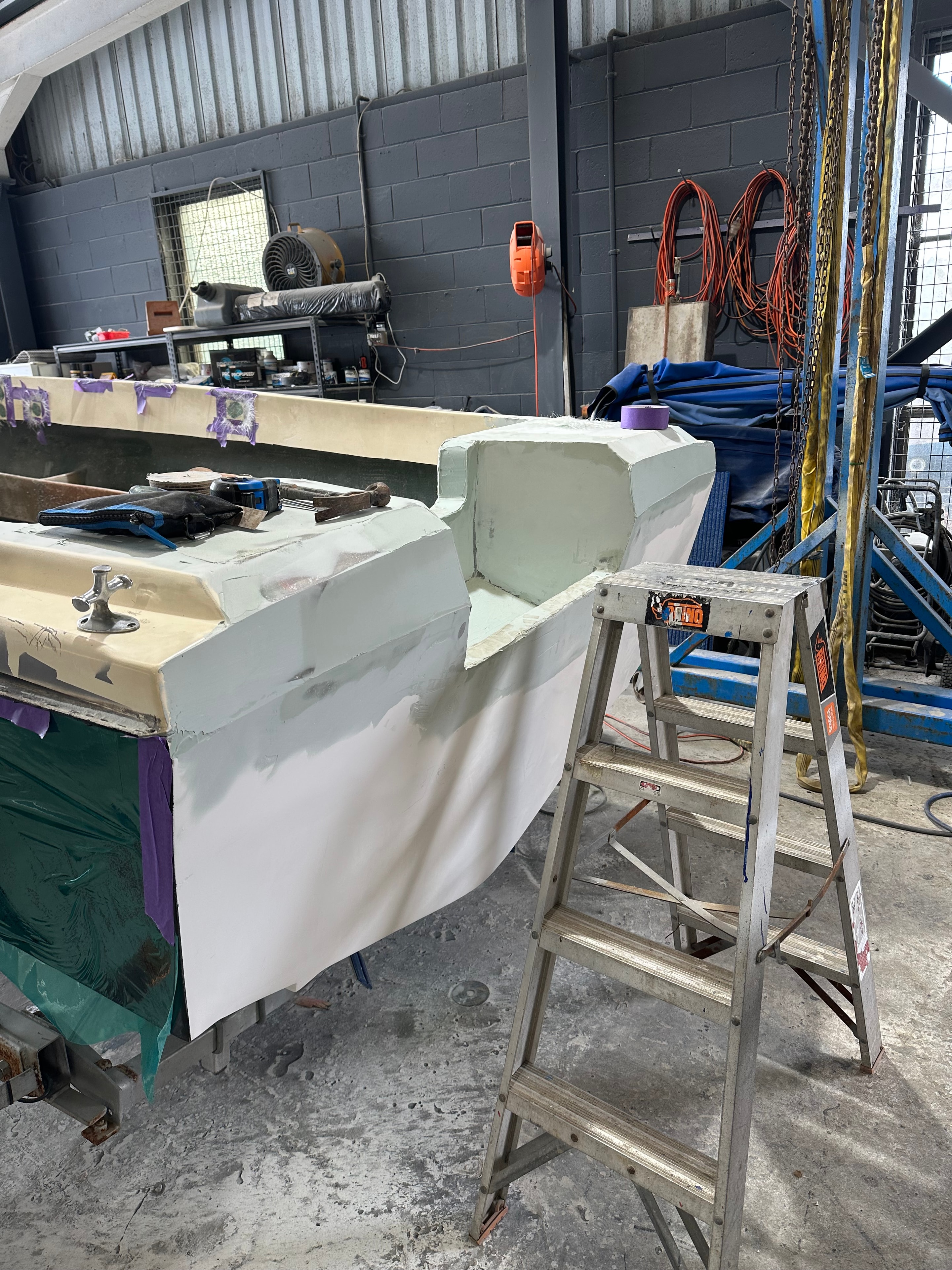 Fibreglass repair and fairing work on hull sides