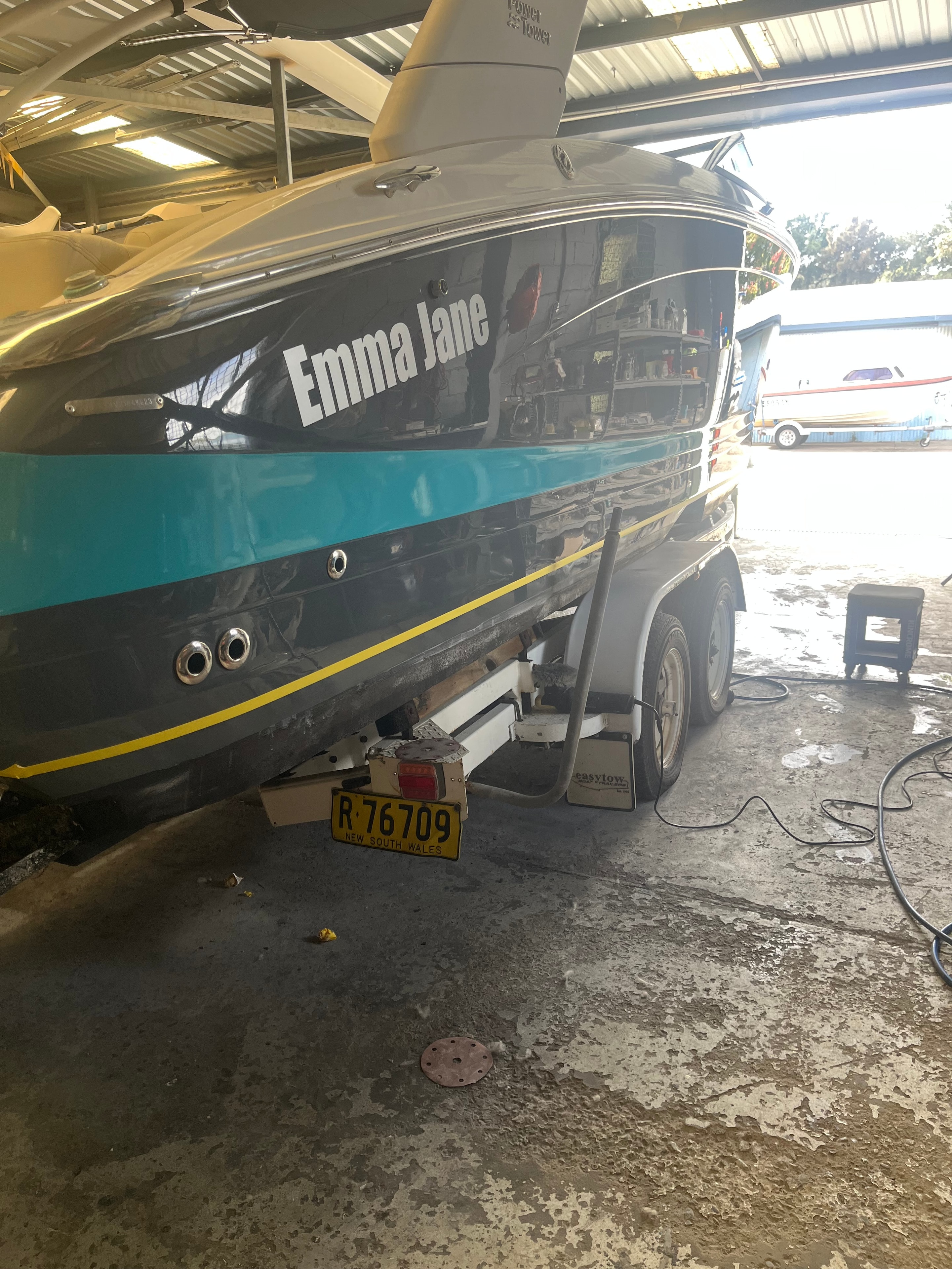 Emma Jane boat teal hull respray in workshop